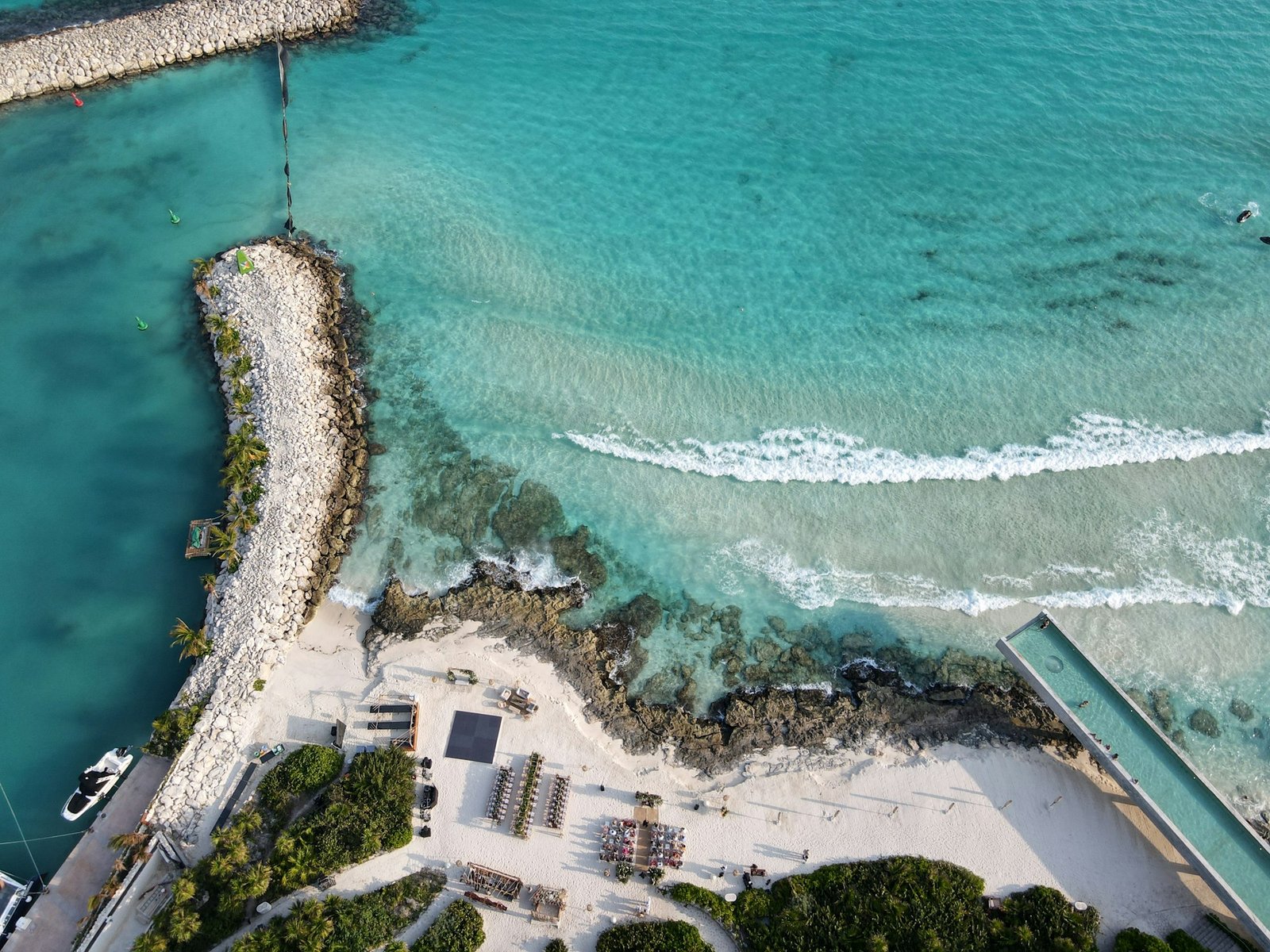 Clear aqua water meeting a coastal shore
