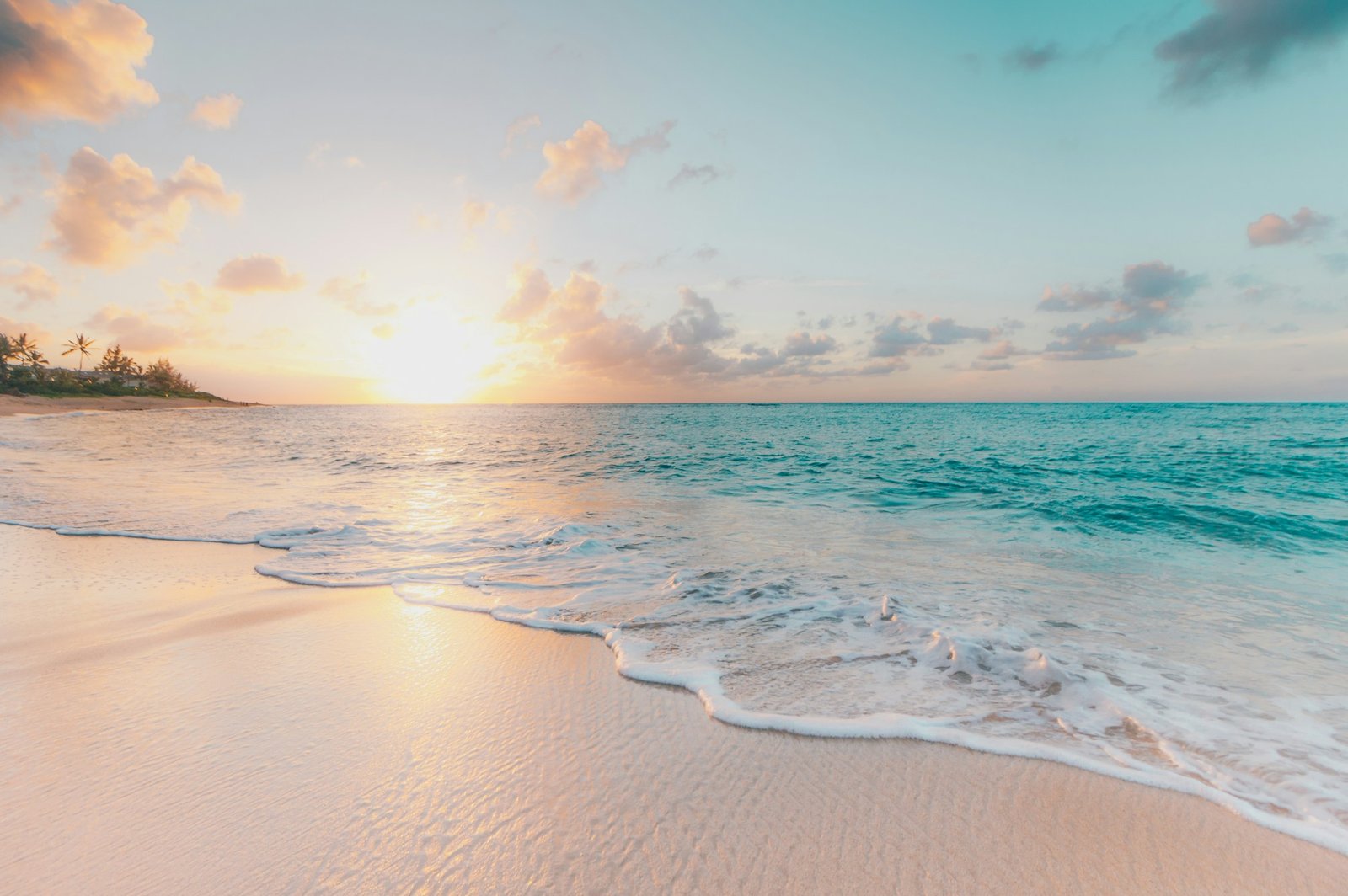 Pale sand and gentle turquoise ocean